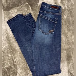 Express dark washed skinny jeans